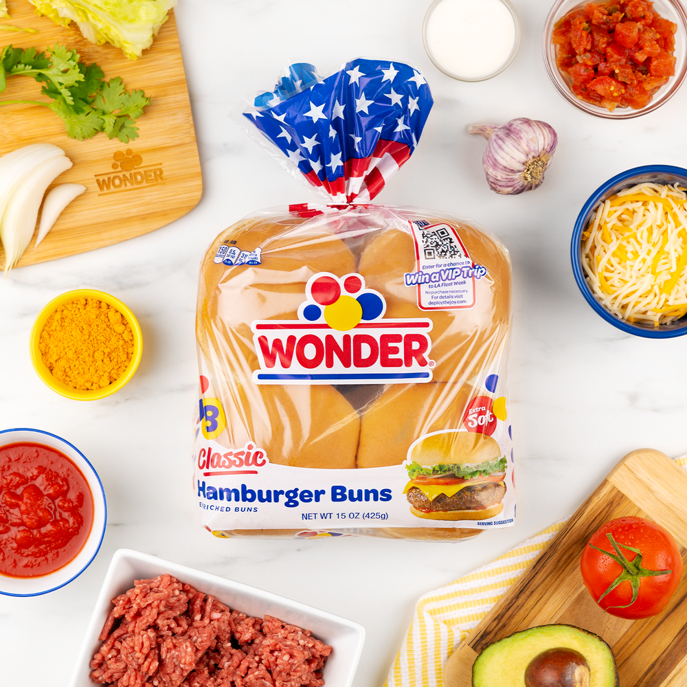 Wonder bread buns surrounded by ingredients